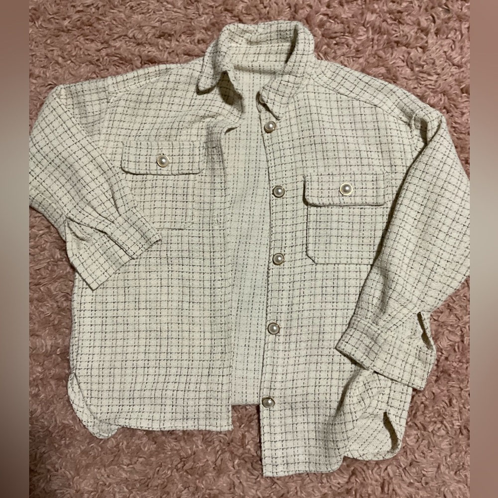 Hello! I am selling a white jacket with gold & pearls with two pockets.